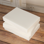 Coconut Soy Wax Blend slabs stacked on a wooden table