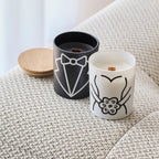 Wood-wick candles in black and white jars with tuxedo and bride designs