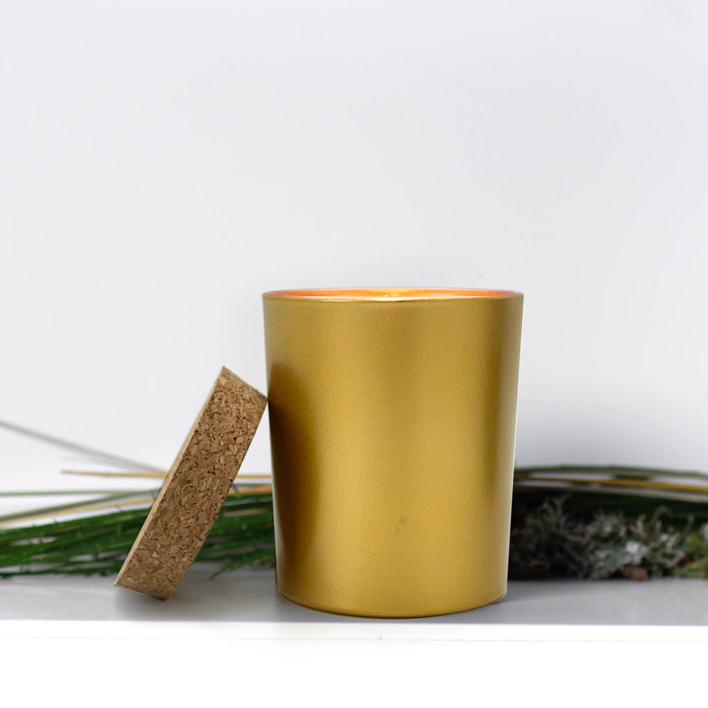 7 oz gold glass jar with a cork lid