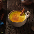 Golden milk turmeric latte with a cinnamon stick