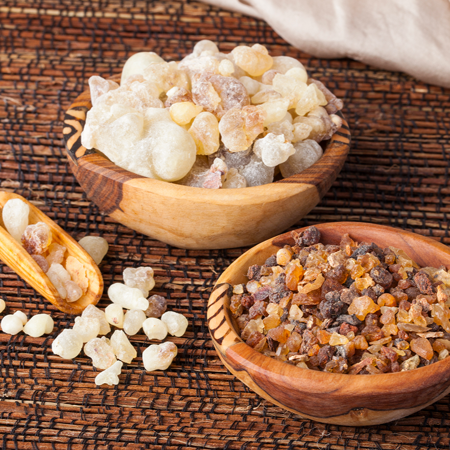 Frankincense and myrrh resin pieces in wooden bowls