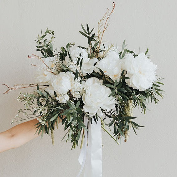 White flowers and greenery in a vase